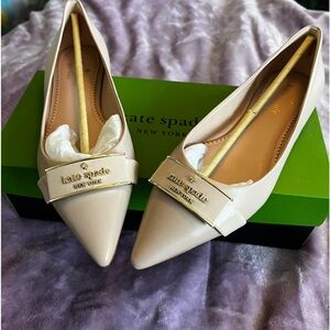 Kate Spade flats in a size 7.